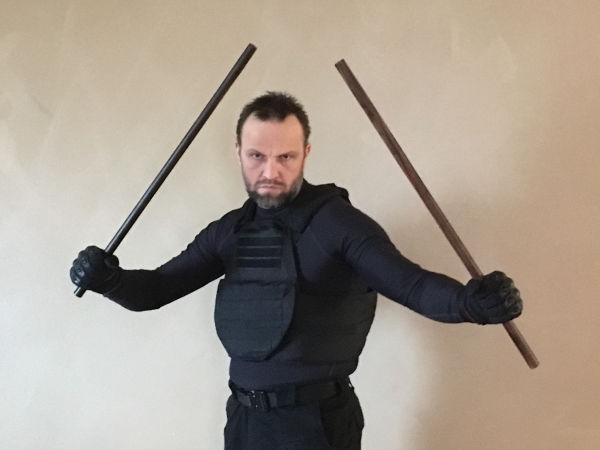 Kelly with fighting sticks